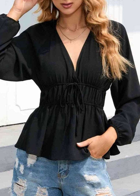 Balloon sleeve punch, neck, peplum blouse in black with drawstring ties