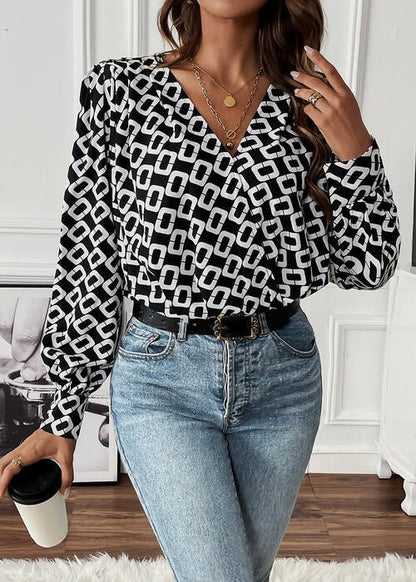 Ladies cross front V-neck, long sleeve geometric pattern blouse in black/white