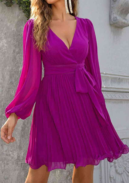 beautiful and feminine fuchsia wrap style dress with pleated skirt nd lantern sleeves